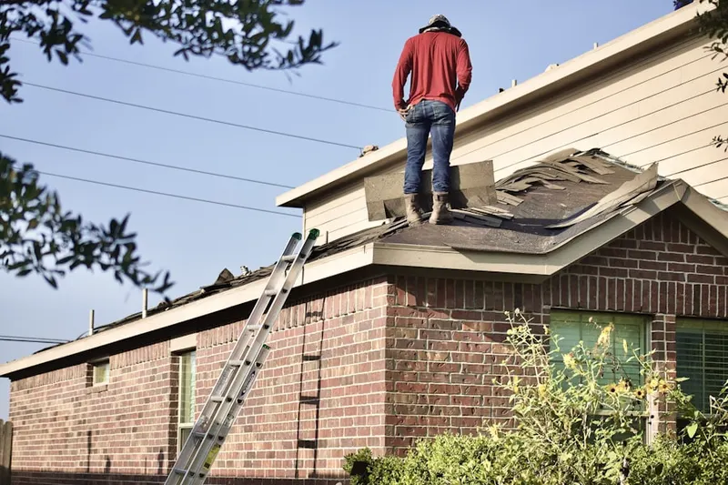 Professional roofer working on a residential roof in Rocky Shoals Estates